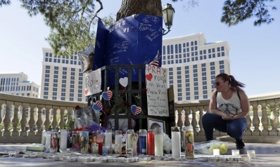 The Latest: Gun shop owner recalls visit by Vegas shooter