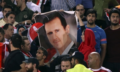 His country a smoldering ruin, but Assad still in his seat