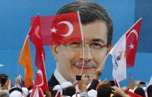 Supporters of the AK Party wave Turkish and party flags as they listen to Prime Minister Ahmet Davutoglu during an election rally for Turkey's June 7 parliamentary election in Istanbul, Turkey, June 3, 2015. REUTERS/Murad Sezer
