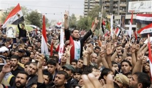 Supporters of anti-U.S. Shiite cleric Muqtada al-Sadr gather in central Baghdad, Iraq, Thursday, April 9, 2009, for a rally marking the sixth anniversary of the fall of the Iraqi capital to American troops. (AP Photo/Karim Kadim)