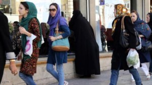 Iranian women, wearing jeans, shop in Tehran on October 7, 2013. A campaign launched by young Iranians on internet networking sites Facebook and Twitter were mocking Israeli President Benjamin Netayahu following his comments during an interview diffused on October 5, in which he implied there is a supposed ban on wearing jeans and listening to Western music in the Islamic Republic. AFP PHOTO/ATTA KENARE        (Photo credit should read ATTA KENARE/AFP/Getty Images)