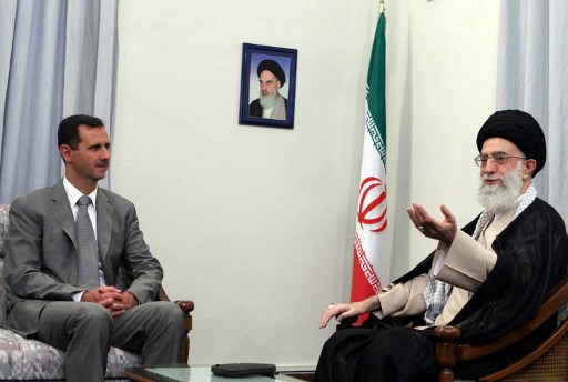 Iran's Supreme Leader Ayatollah Ali Khamenei (R) speaks with Syrian President Bashar al-Assad during their meeting in Tehran on August 3, 2008. Assad wrapped up a two day visit to Syria's staunch regional ally Iran today where he discussed Iran's nuclear policies and other matters of mutual interest. AFP PHOTO/SAJAD SAFARI/MEHR NEWS