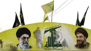 An arch glorifying Hezbollah and baring pictures of its chief Hassan Nasrallah (R) and Iran's spiritual leader Ali Khamenei decorates a street of Beirut's southern subburb on January 16, 2011. Draft charges implicating Hezbollah in the 2005 murder of Lebanese premier Rafiq Hariri are likely to be presented under wraps to the Special Tribunal for Lebanon on January 17, 2011. AFP PHOTO/ANWAR AMRO (Photo credit should read ANWAR AMRO/AFP/Getty Images)