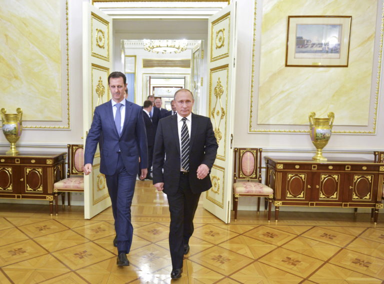 Russian President Vladimir Putin (R) and Syrian President Bashar al-Assad enter a hall during a meeting at the Kremlin in Moscow, Russia, October 20, 2015. Assad made a surprise visit to Moscow on Tuesday evening to thank Putin for launching air strikes against Islamist militants in Syria. Picture taken October 20, 2015. REUTERS/Alexei Druzhinin/RIA Novosti/Kremlin ATTENTION EDITORS - THIS IMAGE HAS BEEN SUPPLIED BY A THIRD PARTY. IT IS DISTRIBUTED, EXACTLY AS RECEIVED BY REUTERS, AS A SERVICE TO CLIENTS.   - RTS5E2Z
