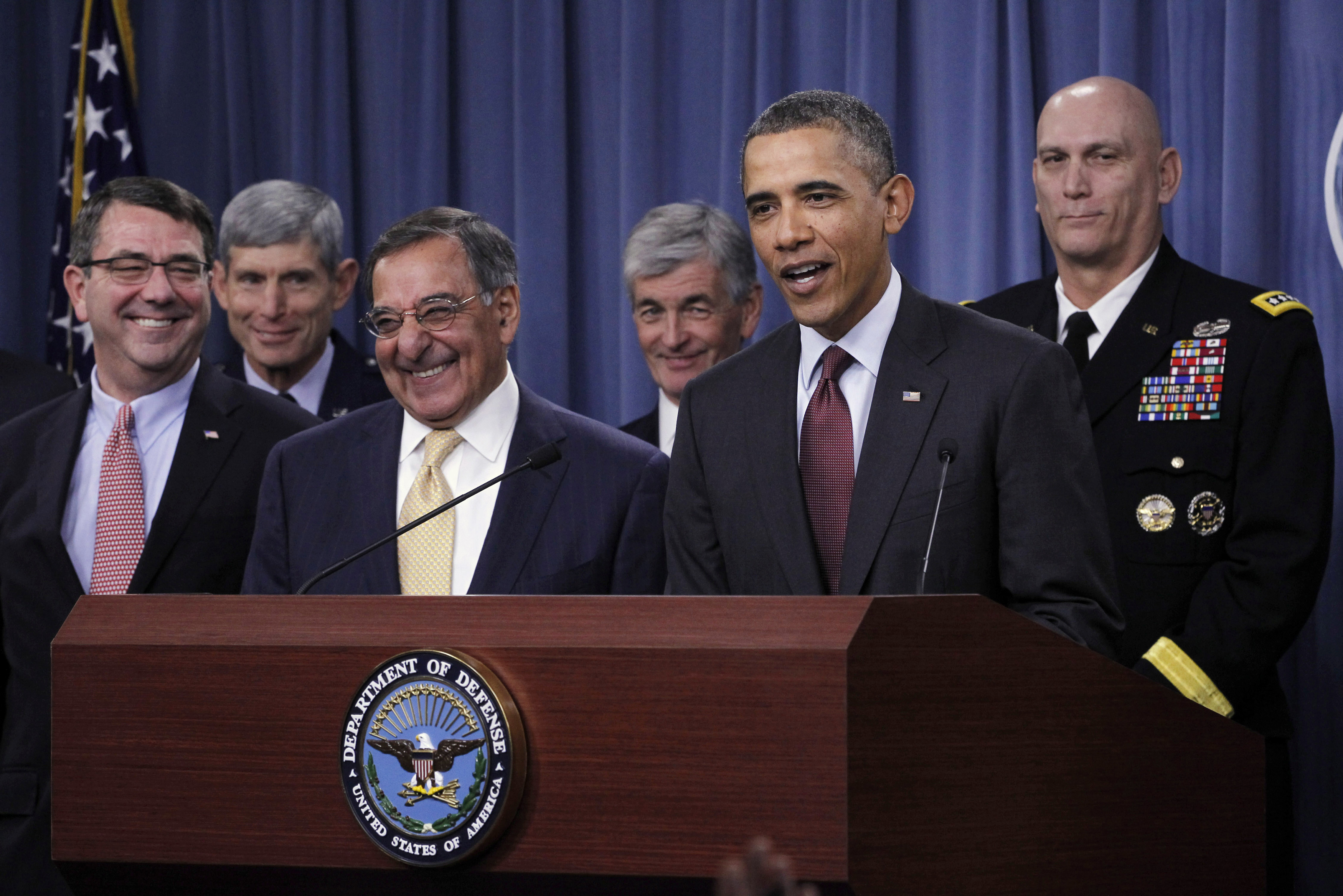 U.S. President Barack Obama delivers remarks on the Defense Strategic Review at the Pentagon near Washington, January 5, 2012.  With Obama are (front row, L-R) Deputy Secretary of Defense Ashton Carter and Secretary of Defense Leon Panetta, (back row L-R)  Air Force Chief of Staff General Norton Schwartz, Secretary of the Army John McHugh, Chief of Staff of the Army General Raymond Odierno, Commandant of the Marine Corps General James Amos, Secretary of the Navy Ray Mabus, Chief of Naval Operations Admiral Jonathan Greenert and Chief of National Guard Bureau General Craig McKinley.   REUTERS/Jason Reed   (UNITED STATES - Tags: POLITICS MILITARY)