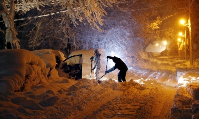 Storm moves up East Coast dumping snow, knocking out power