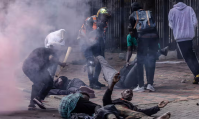 Kenyan police open fire on protesters as crowd tries to storm parliament