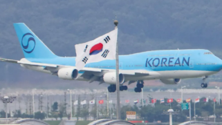 South Korean workers detained in US raid arrive home