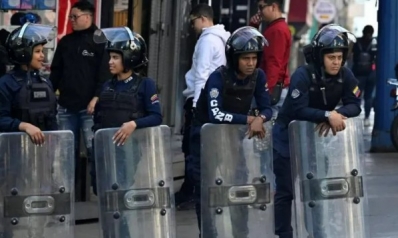 Venezuelan security forces detain journalists as armed police patrol streets