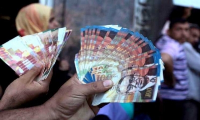مسؤول فلسطيني يطالب بالإستغناء عن العملة الإسرائيلية للتخلص من التبعية الإقتصادية لإسرائيل