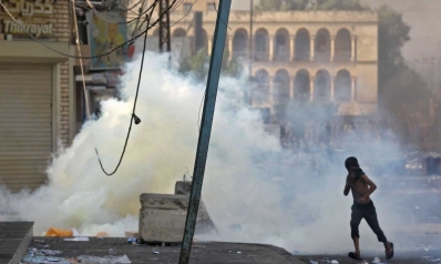 بغداد تستيقظ على الرصاص الحي رغم حظر التجول في ثالث يوم للاحتجاجات الدامية